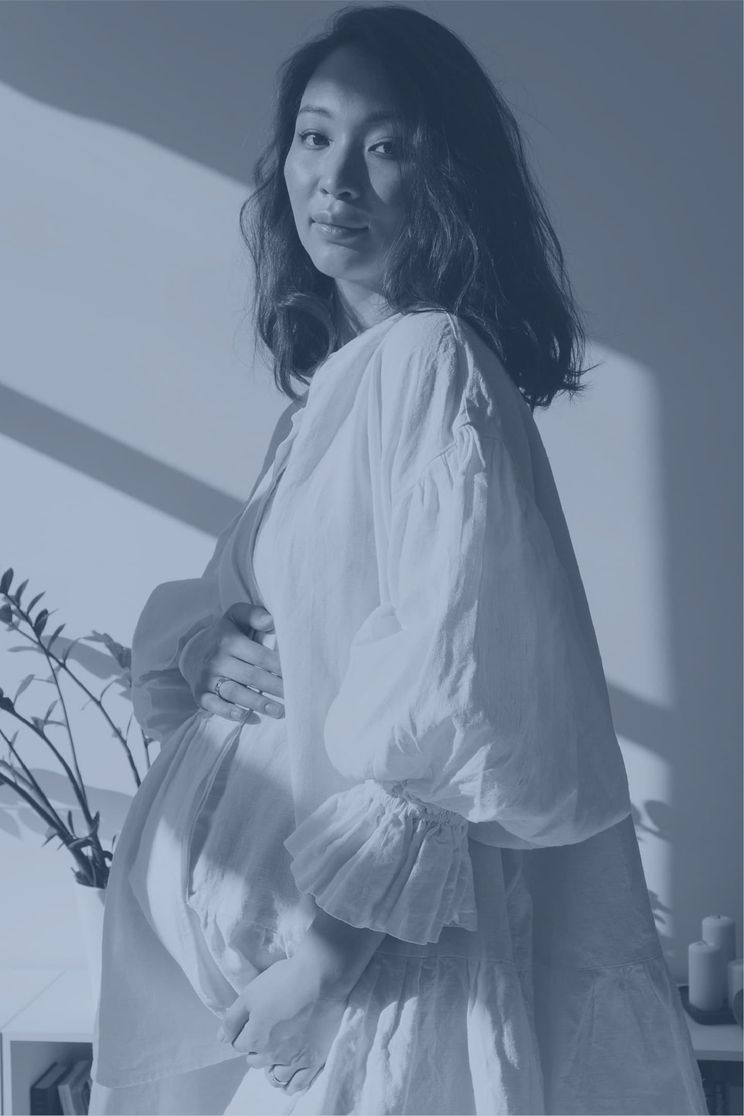 Woman in a flowy dress looking at the camera