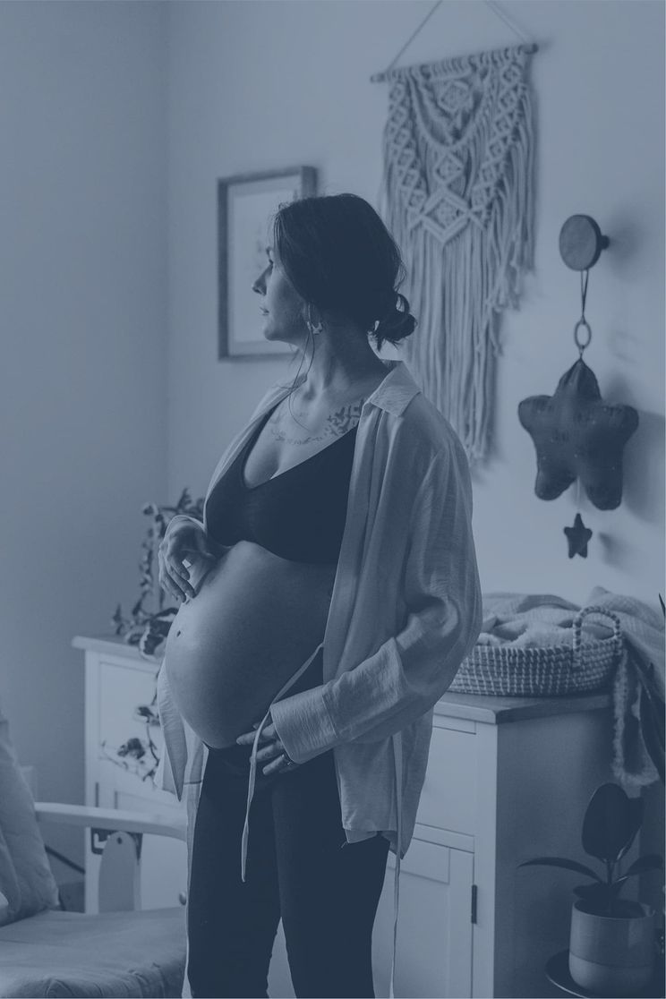 Woman holding her pregnant belly